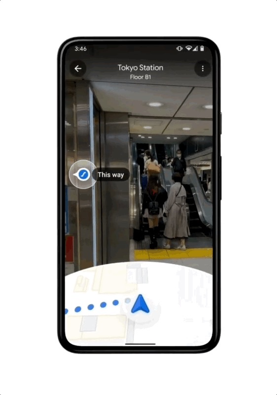 Indoor AR navigation guiding a user through Tokyo Station with a This Way marker and minimap
